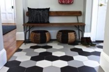 08 large scale hexagon tiles in different colors in the entryway flow into wamr-colored laminate in the rest of the space