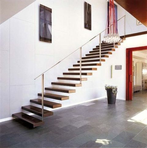 a floating staircase with steps attached to the wall looks very natural and very modern