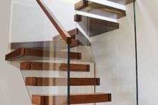11 a floating wooden staircase attached to glas banisters with wooden railings looks wow