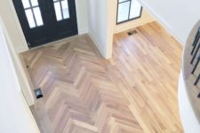 11 laminate clad in a chevron pattern and more regular laminate in the rest of the space with no gradual transition