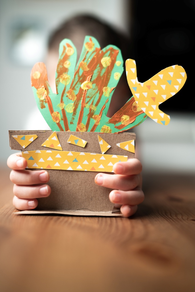 funny handprint paper cactuses in planters