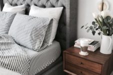 16 a grey upholstered bed with a wingback headboard and grey bedding is a very relaxing and calming idea