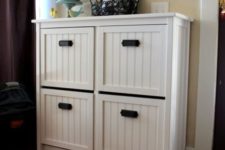 16 revamp your IKEA Hemnes shoe storage with beadboard and black pulls for a more rustic and relaxed look