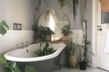 17 hanging potted greenery and some plants by the bathtub and in it for a fresh feel
