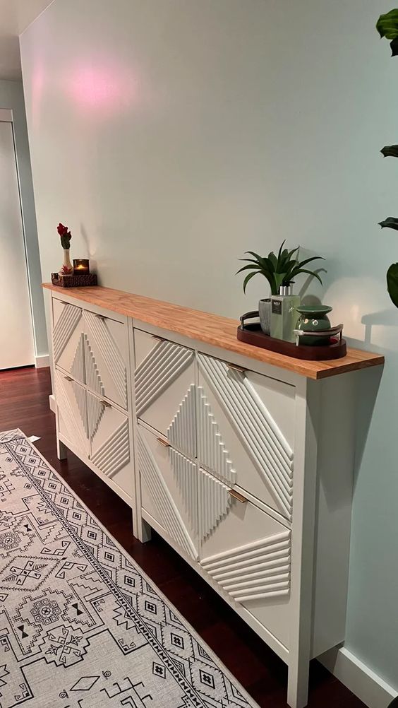 IKEA Hemnes cabinets hacked with elegant pulls and with inlays plus a wooden countertop is a stylish idea for a Scandi space
