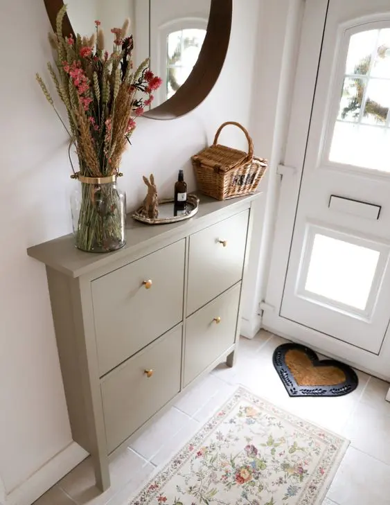 a beautiful IKEA Hemnes greige hack with gold knobs is a stylish idea for a boho space