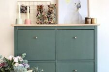 a dark green IKEA Hemnes shoe cabinet hack with a wooden countertop is a stylish idea for a modern home