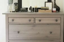an IKEA Hemnes shoe cabinet given a chic look with wood stain and wooden knobs for a rustic feel
