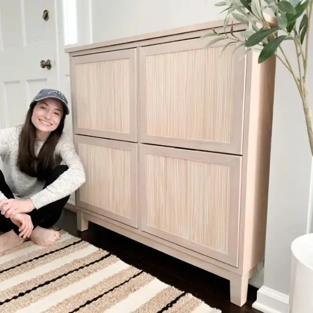 an IKEA Stall hack with fluted doors and frames is a cool solution for a modern entryway