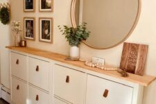 an IKEA Stall shoe cabinet upgrade with a stained countertop and leather pills is a lovely idea for a boho space
