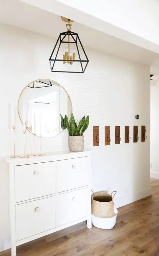 an elegant IKEA Stall hack with white knobs and tall legs is a stylish idea for a boho space
