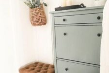 an olive green IKEA Hemnes shoe cabinet makeover with black knobs is a perfect modern, modern farmhouse or Scandinavian piece