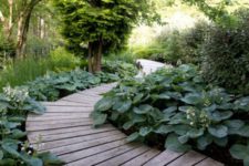 04 a beautiful wooden path going down and surrounded with greenery completely for a fresh look