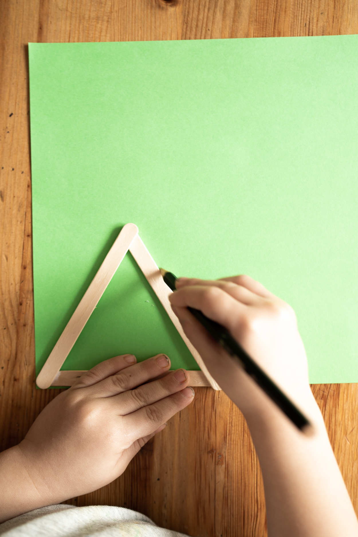 Put your triangle on colored paper and trace it