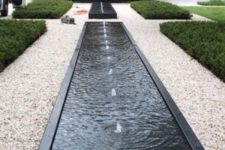 05 modern box fountains in the front yard boost the contemporary feel of the house and outdoor spaces
