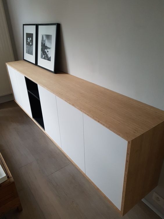 a chic contemporary floating sideboard of IKEA Metod cabinets and Tutema cabinets plus a light colored wooden cover