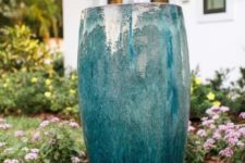 11 a large turquoise bowl fountain in the front yard will add a relaxing touch to the space