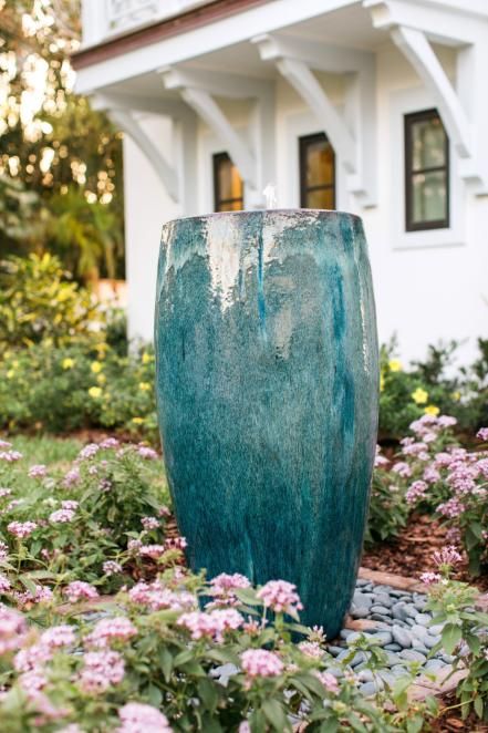 a large turquoise bowl fountain in the front yard will add a relaxing touch to the space
