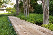 11 a raised wooden pathway is a comfortable and welcoming idea for any modern garden
