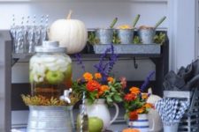 11 a rustic meets vintage drink bar with pumpkins and apples and bold fall blooms plus drinks