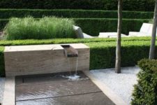 12 a beautiful and contemporary front yard fountain adds an attractive touch to the space