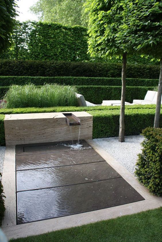 a beautiful and contemporary front yard fountain adds an attractive touch to the space