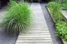 12 a simple whitewashed wood garden path placed on usual gravel looks laconic, simple and casual