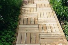 14 a wooden garden path done with stripes in different directions is a stylish and catchy idea