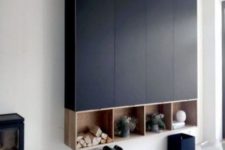 15 a large black storage unit built of several IKEA Metod cabinets and some open storage boxes underneath looks very contemporary