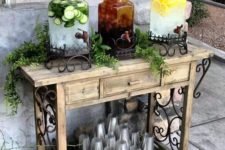 17 a vintage meets rustic drink bar of wood with forged decor, a basket with plastic cups and some chic tanks
