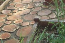 24 a wood slice garden path with wooden borders looks pretty natural and rustic, you can DIY one fast