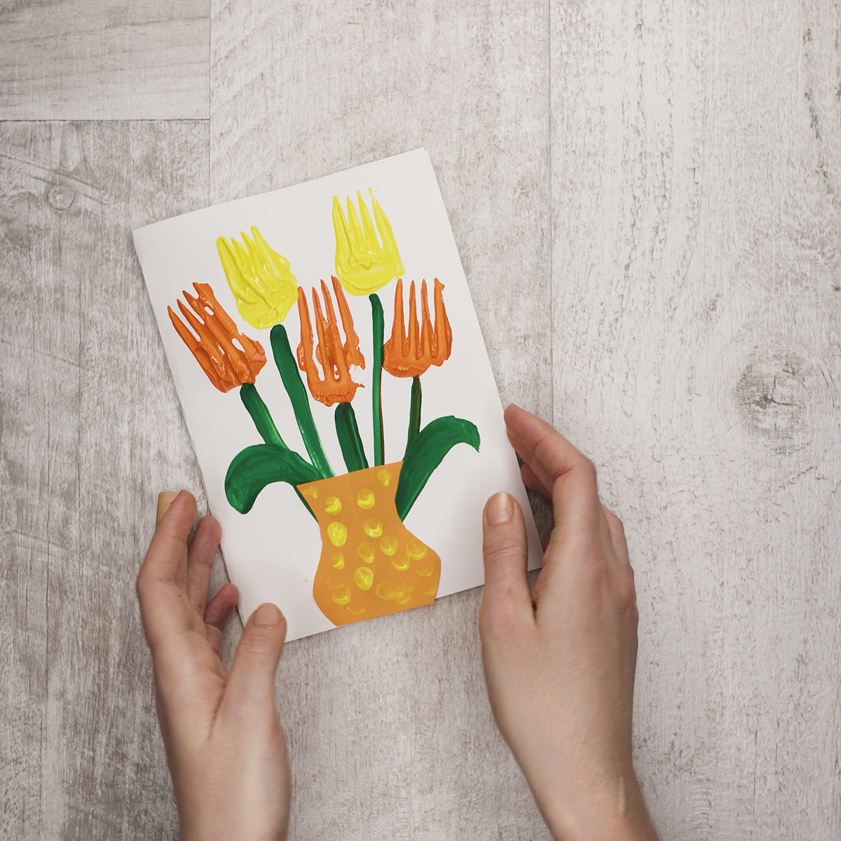 Make the vase catchier using yellow paint and your finger – just stamp some paint on it