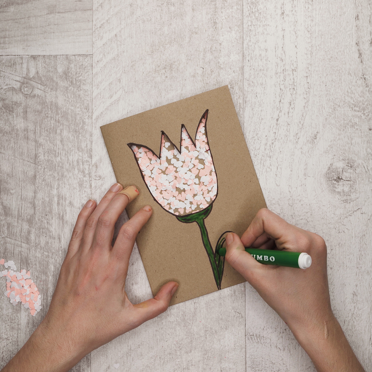 Cover the footstalks and leaves of the tulips with a green sharpie