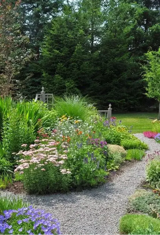 a bright garden with greenery, blooms and gravel pathways is a lovely idea for a relaxed space with a rustic feel