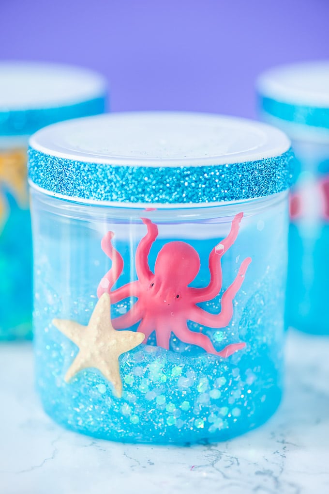 DIY glitter ocean slime with sea creatures (via apumpkinandaprincess.com)