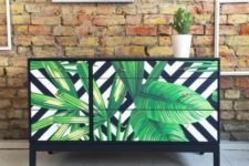 02 a black dresser with drawers covered with bright tropical leaf contact paper looks very contrasting