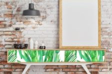 06 a tropical leaf printed long console table will turn your entryway or living room bold and chic