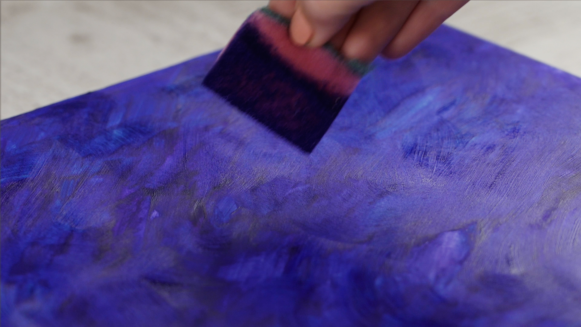 Take the sponge and apply it to the paper to create a texture.