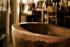 08 a carved wooden bathtub with natural grain will turn your bathroom into a natural relaxation oasis