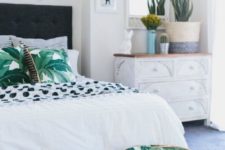 09 tropical leaf printed pillows and a small ottoman to match will make your bedroom feel tropical and boho
