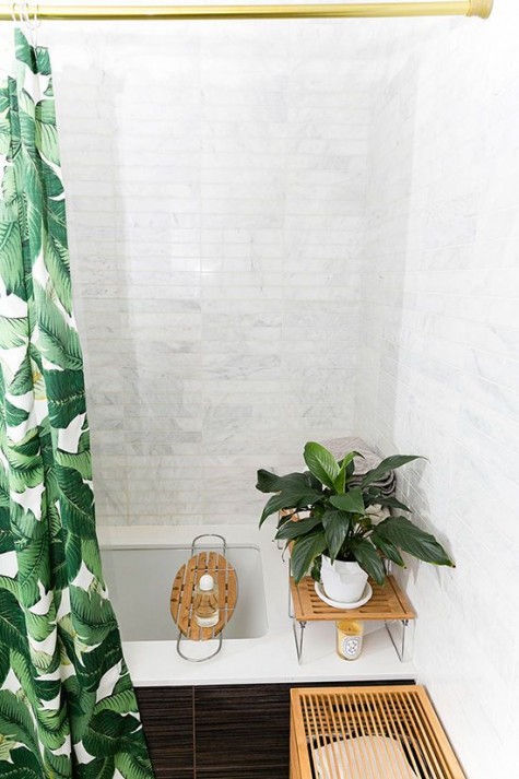 a banana leaf shower curtain will make your bathroom feel like outdoors