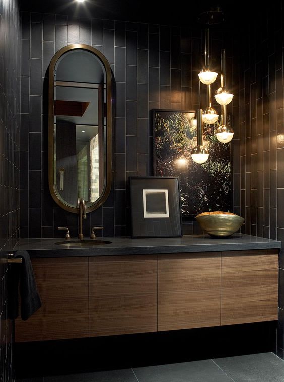black tiles highlighted with white grout look nice with brass and light-stained wood