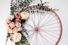 DIY old bike wheel wreath with fresh or fake blooms