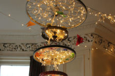 DIY large bike wheel chandelier with many lights