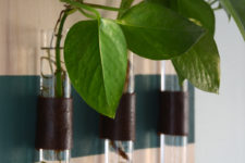 DIY wall-mounted test tube vases using leather