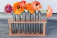 DIY wood and test tube installation with blooms