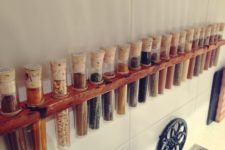 DIY wall-mounted spice rack with test tubes and cork