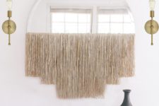 DIY semi circular mirror with long champagne-colored shiny fringe