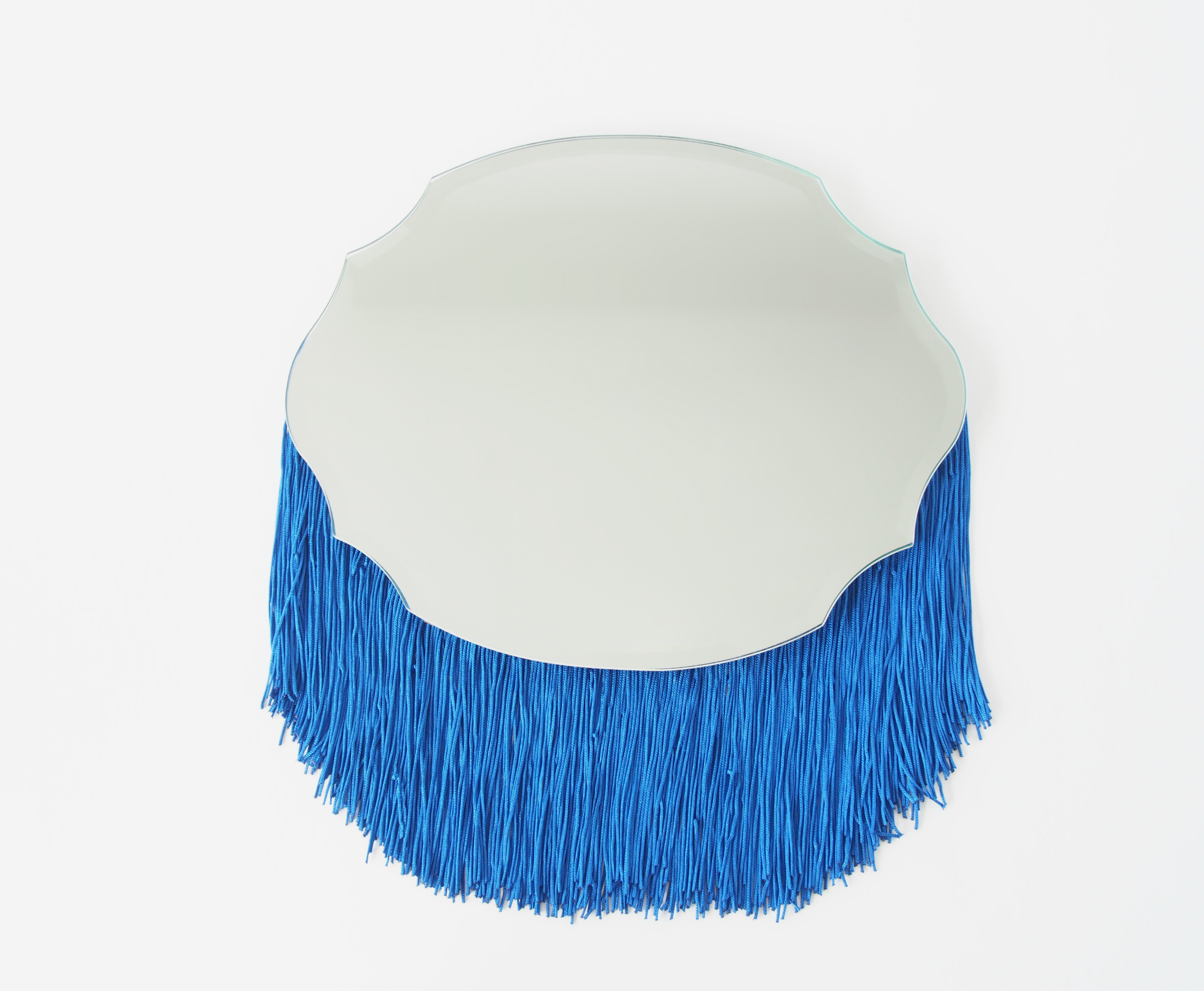 DIY quirky shaped mirror with bright blue fringe