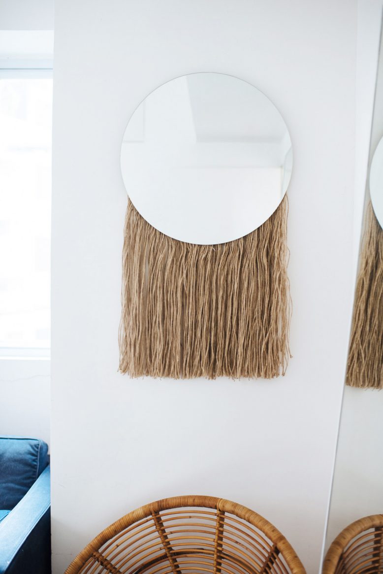 DIY round mirror with long fringe attached to the back